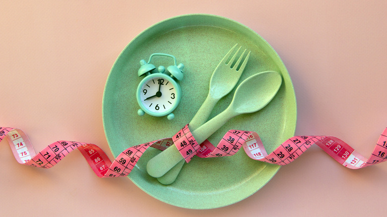 diet concept with plate and tape