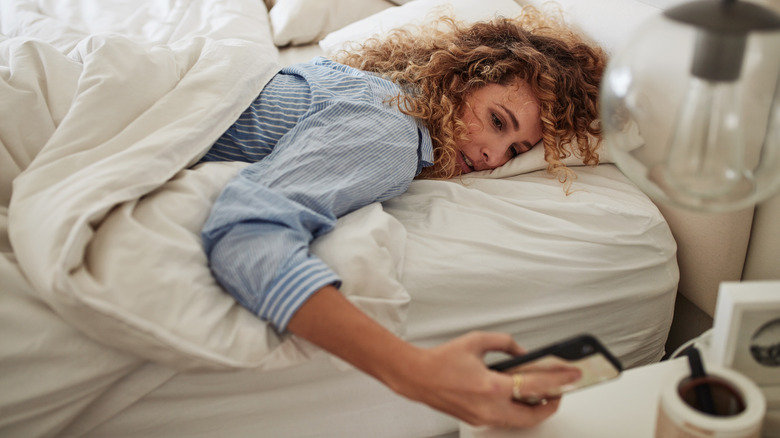 Woman waking up in bed