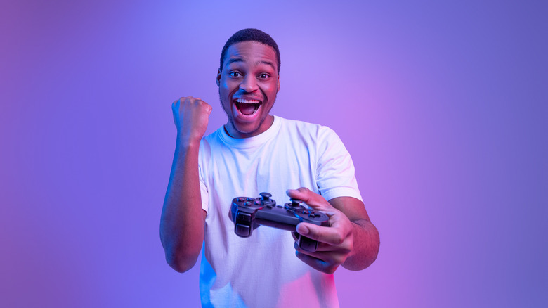 man celebrating win video game
