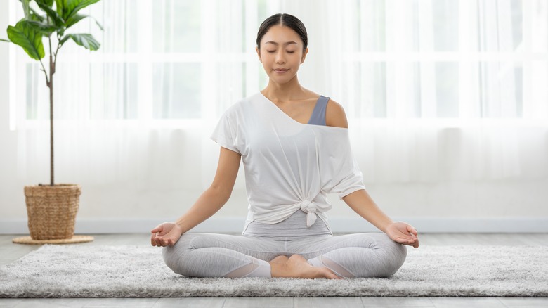 A woman practices yoga