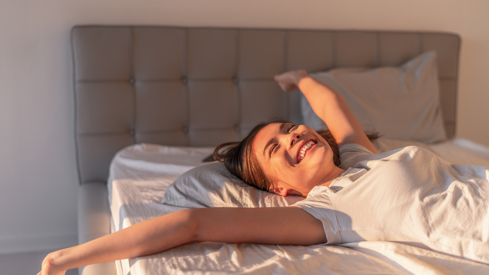 Woman waking up feeling well rested