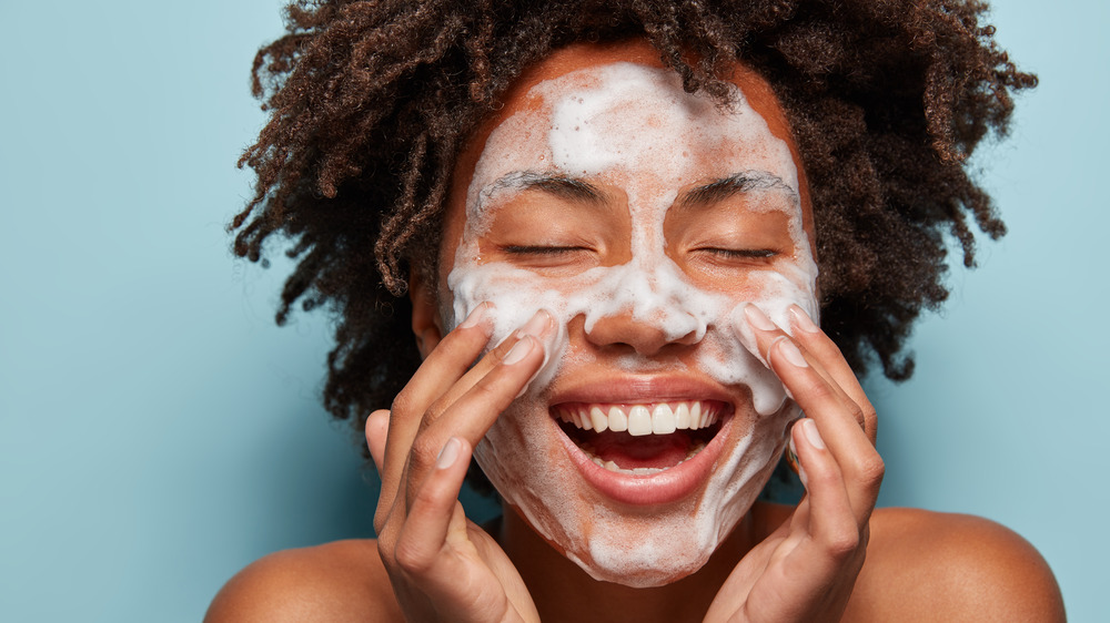 Woman washing face