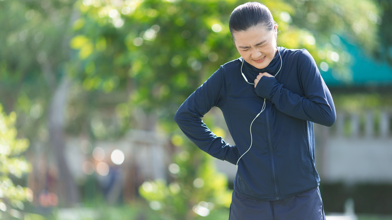 woman running with heartburn