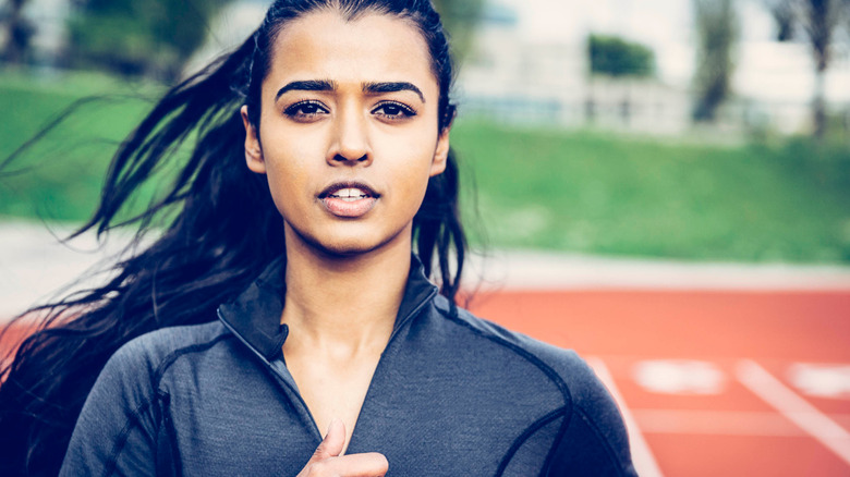 woman running on track