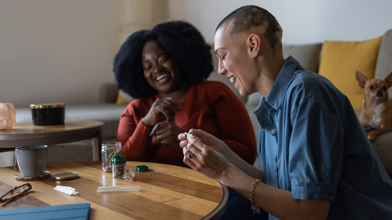 Friends rolling marijuana joints