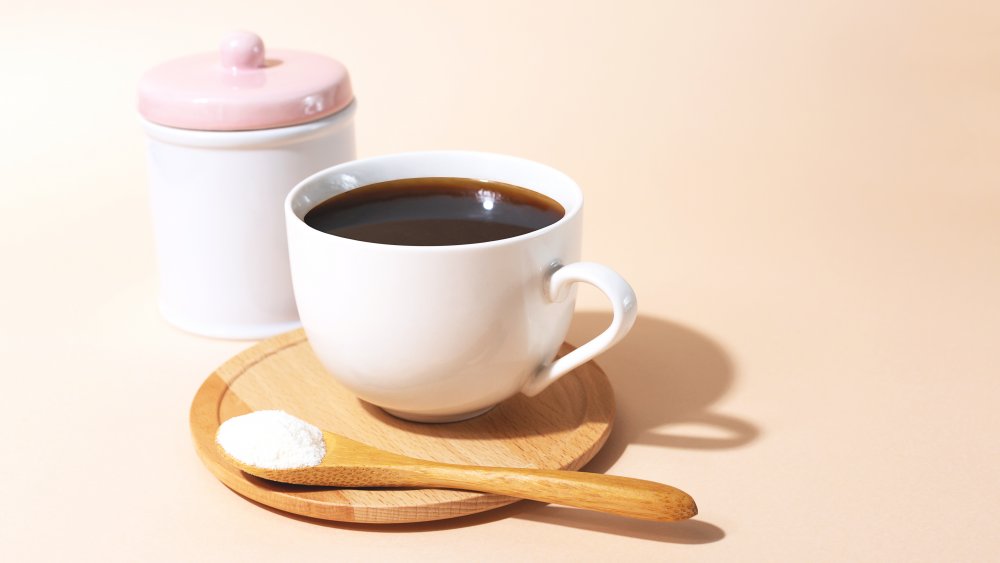 Collagen and coffee on pink background