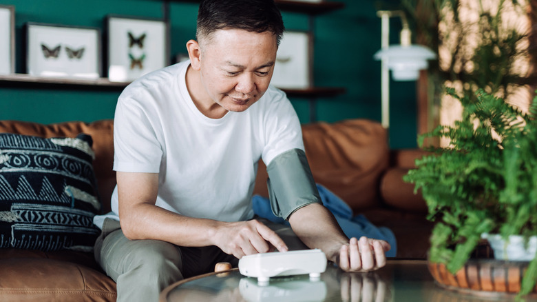 Older adult measuring blood pressure