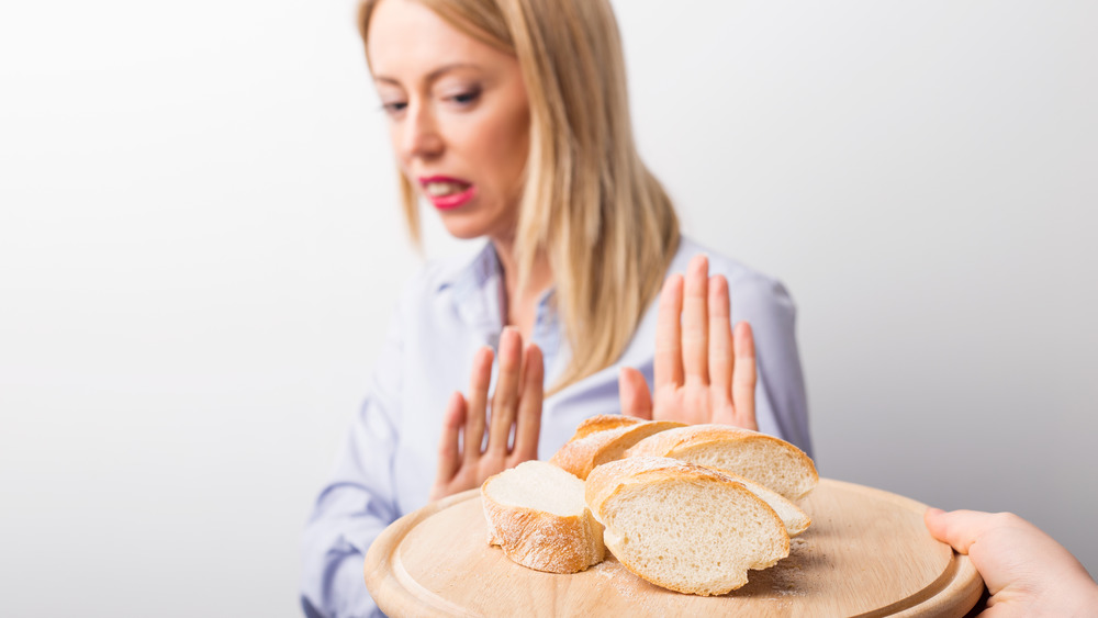 Woman refusing bread