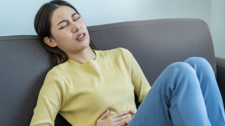 woman struggling with gas