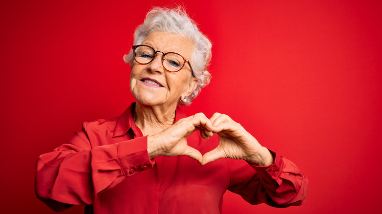 woman making heart shape