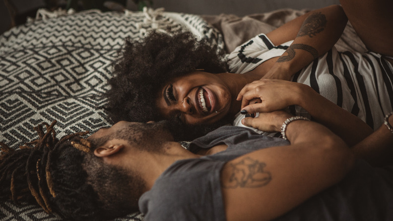 happy couple in bed together