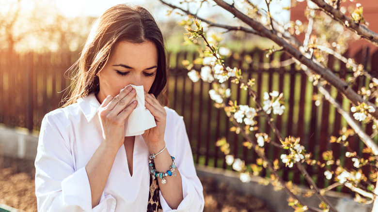 Woman wiping nose