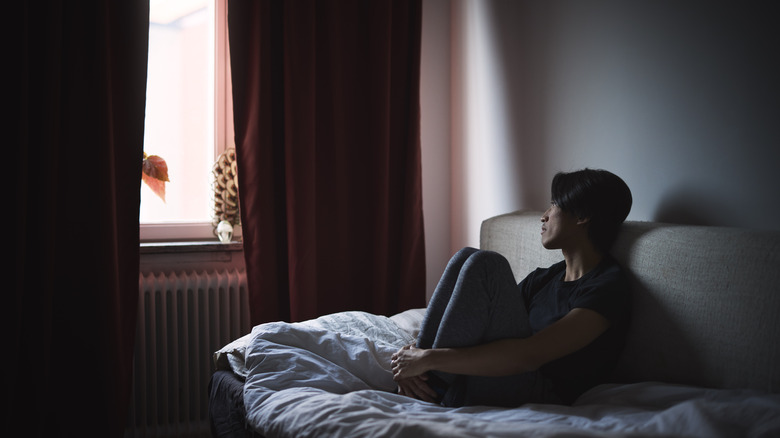 sad man sitting on a sofa