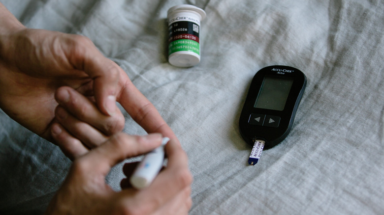 person checking blood sugar