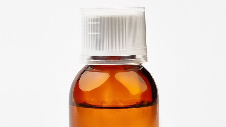 a bottle containing liquid medicine