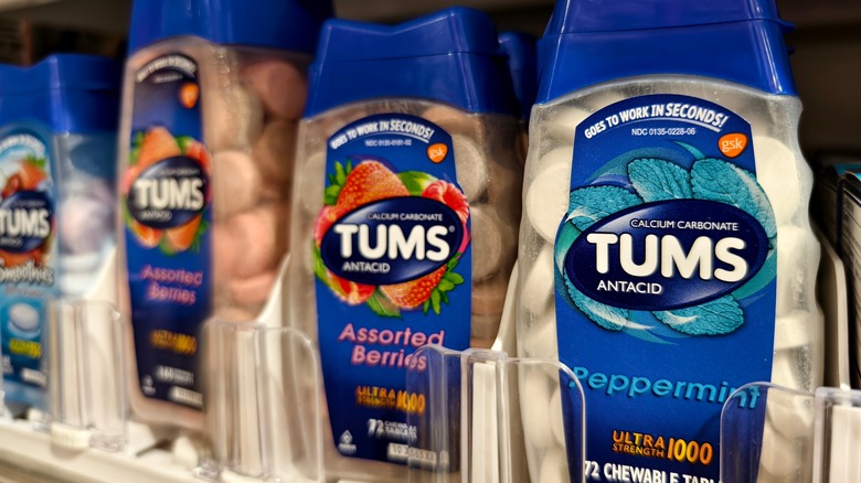 Three bottles of Tums on shelf