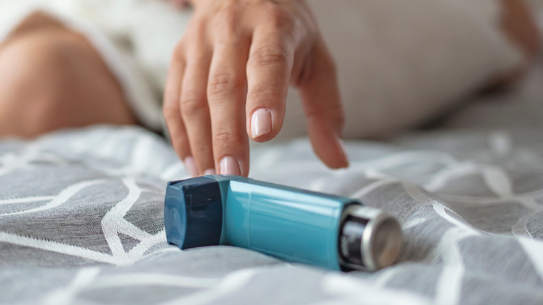 Closeup of an inhaler on bed