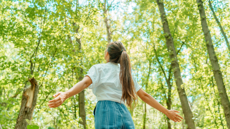 woman in nature, happiness and freedom concept