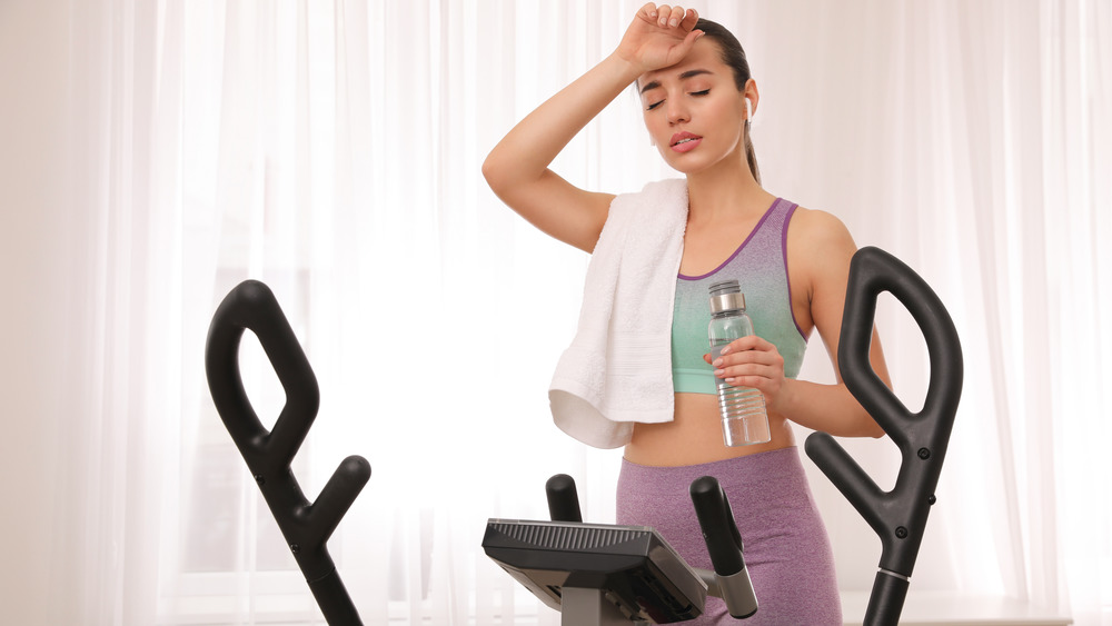 woman tired after elliptical training