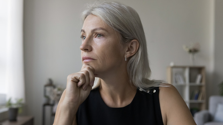 Woman at computer having difficulty concentrating