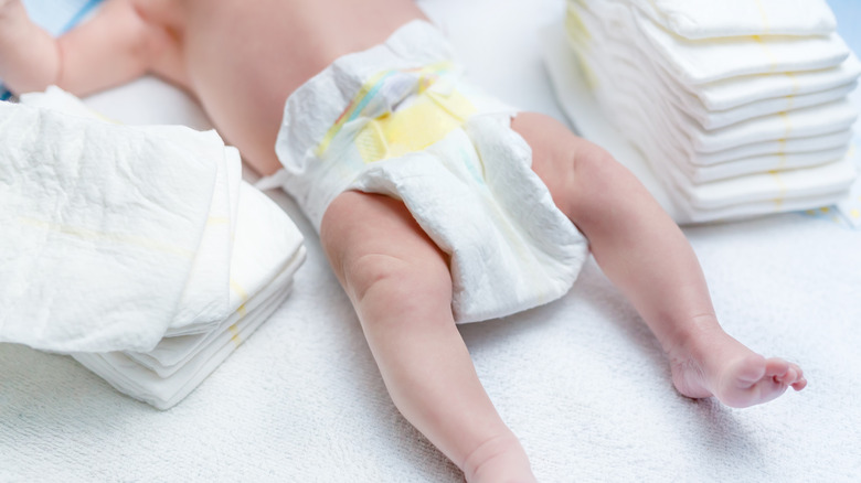 newborn baby on changing table