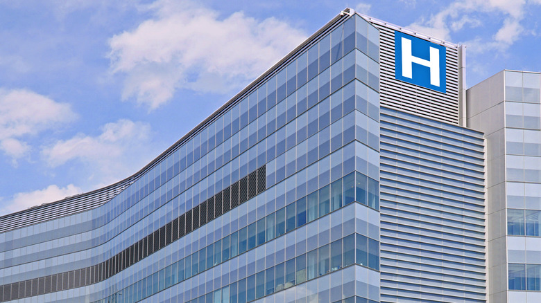 building with an H photoshopped onto it to look like a hospital