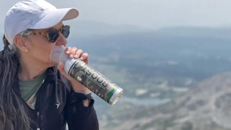 Hiking woman using Boost Oxygen