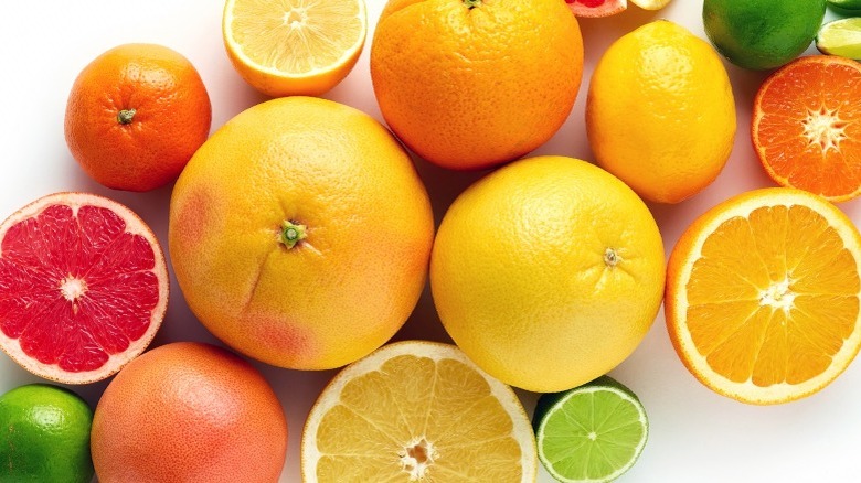 An assortment of citrus fruits on white background