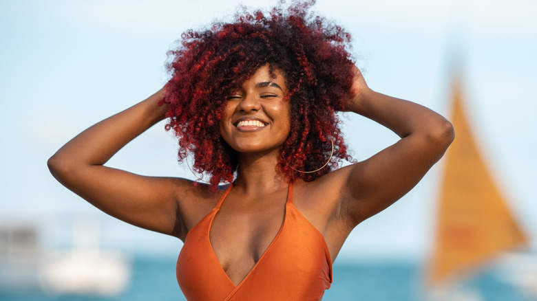 Woman touching hair