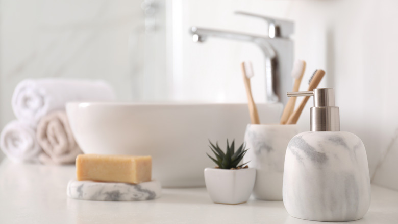 toothbrushes next to bathroom sink