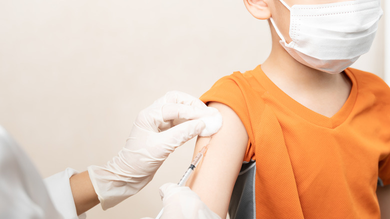 child getting vaccine