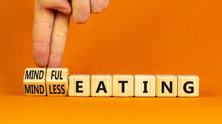 lettered wooden blocks spell out mindful/mindless eating