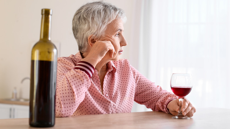 Senior woman drinking wine