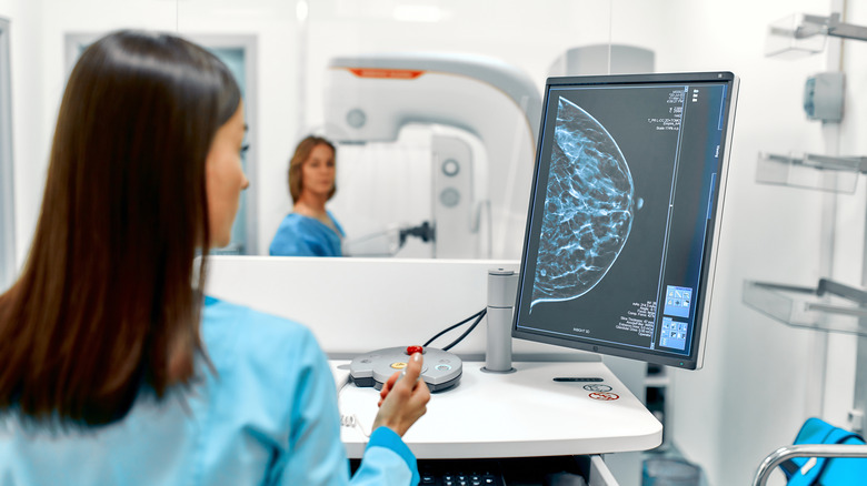 Doctor examines mammogram results on a computer screen