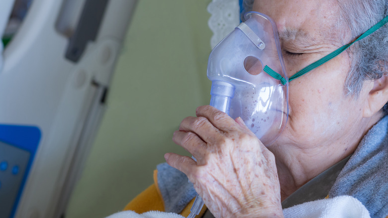 senior woman with oxygen mask