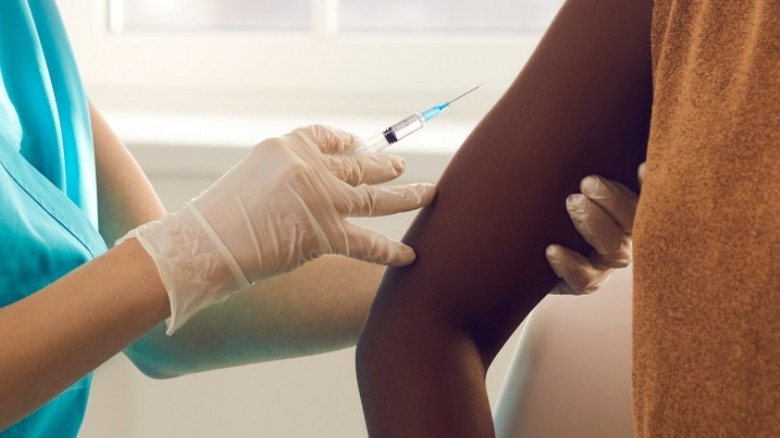 woman getting COVID vaccine