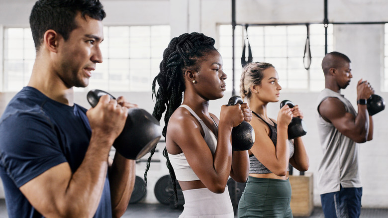 fitness class using dumbbells