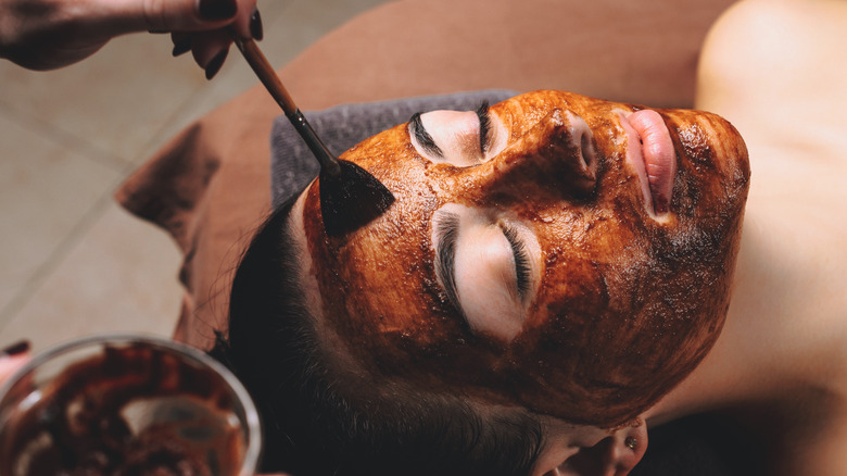 Woman wearing caffeine mask