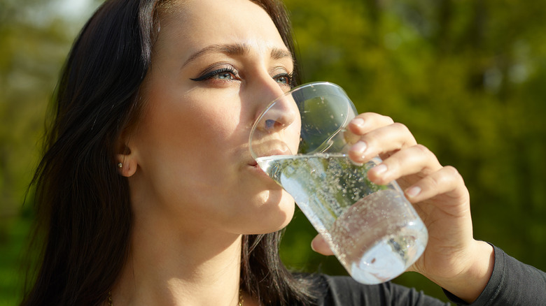 Woman drinking sparkling water