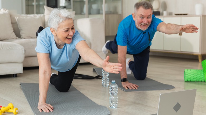 older couple working out at home