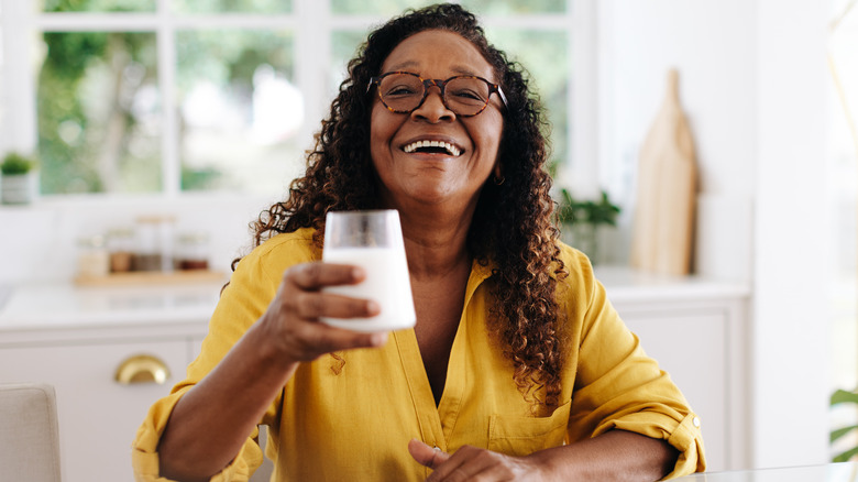 older woman drinking milk