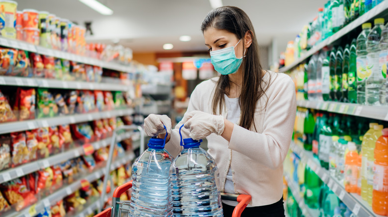 A woman buys water