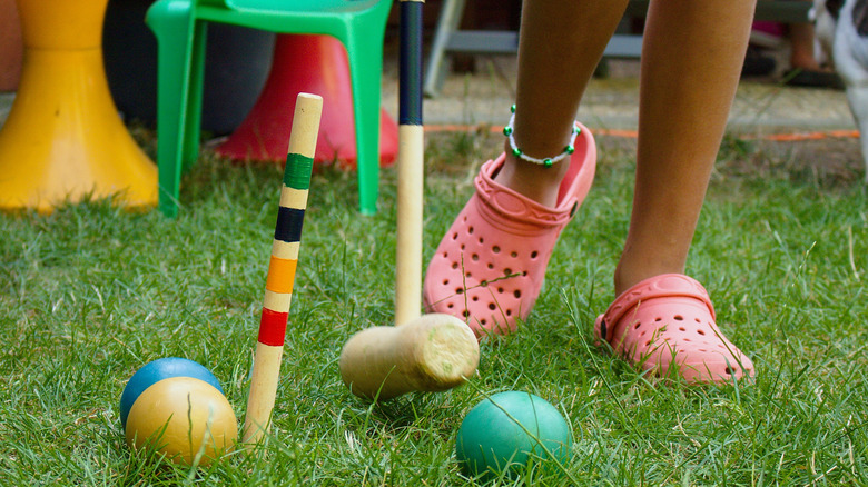 Child playing croquet