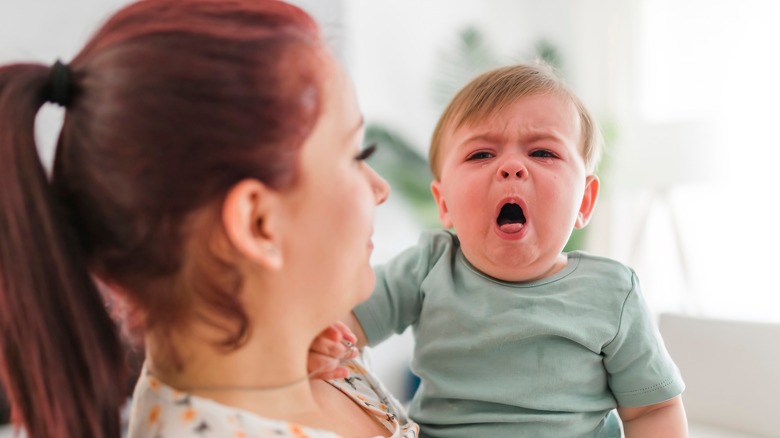 small boy coughing