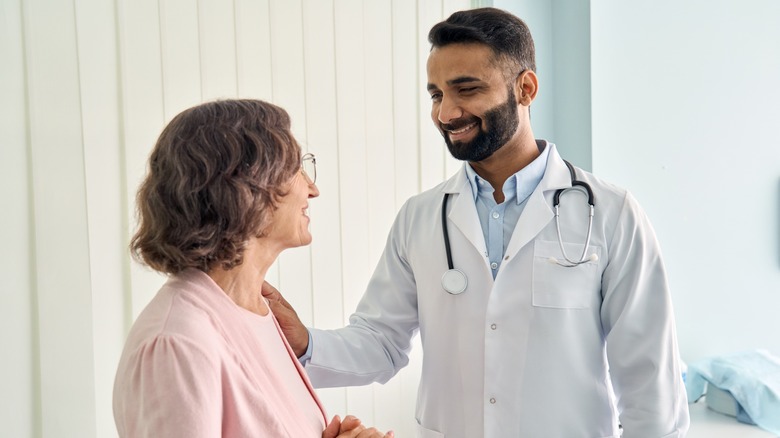 male doctor talking to a woman