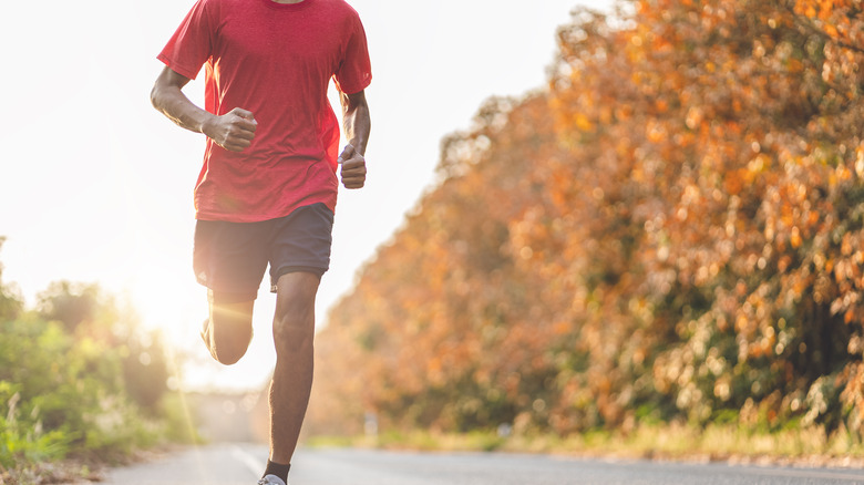 a man running during autumn 