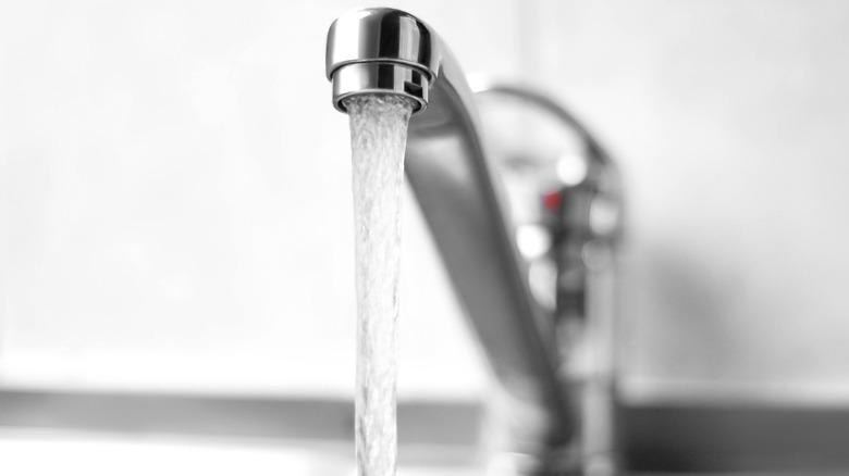 Close up of running sink tap water