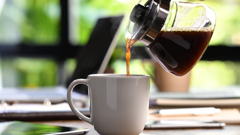 Pouring coffee into mug