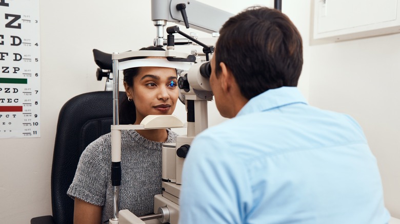 young black woman getting eye exam