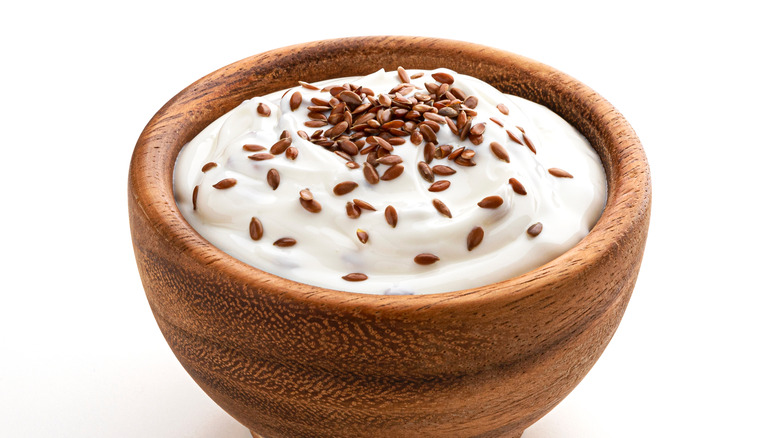 bowl of yogurt topped with flaxseed